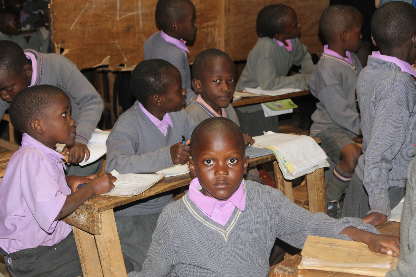 A student in uniform in the classroom.